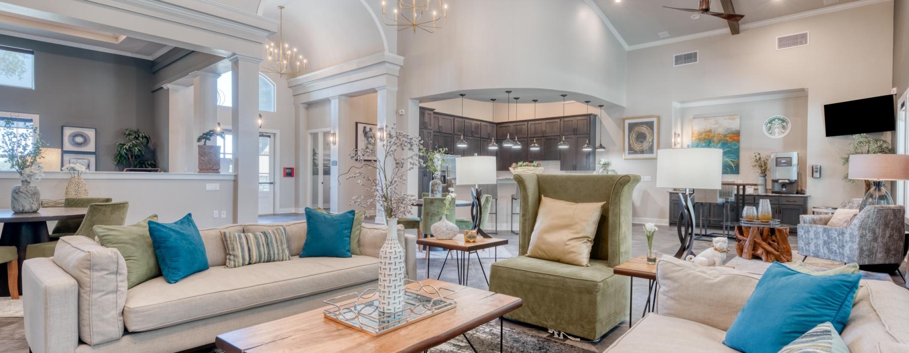 a living room with a chandelier and a couch