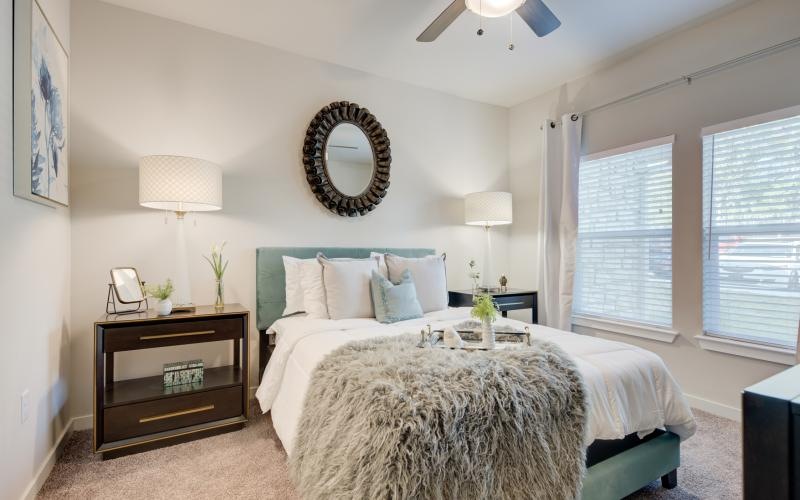 a bedroom with a large mirror