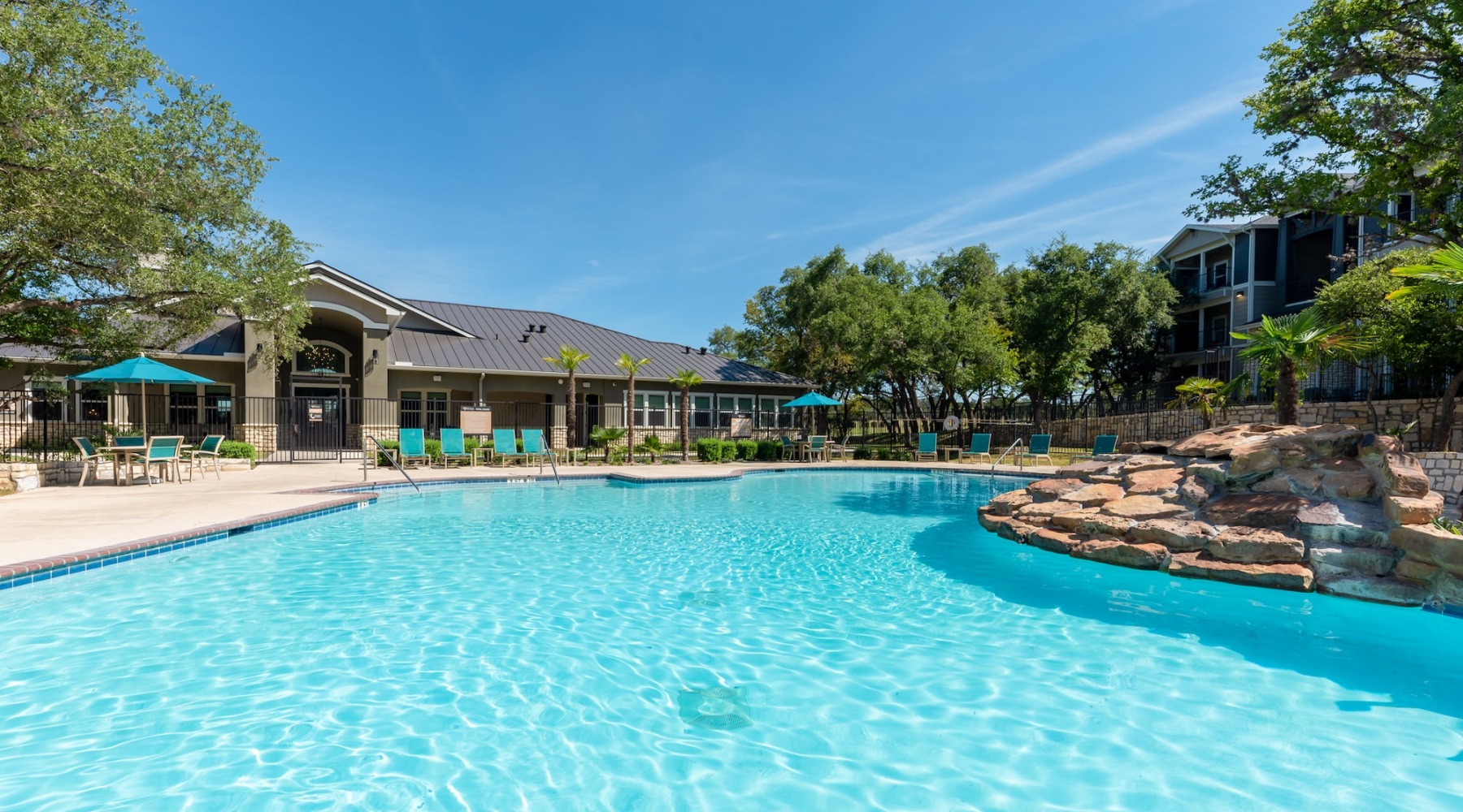 a swimming pool in front of a house