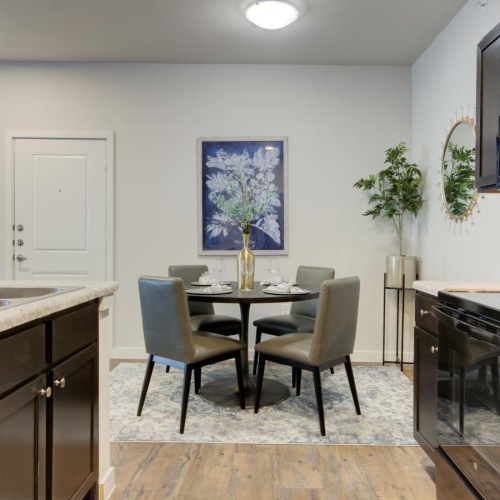 a kitchen with a table and chairs